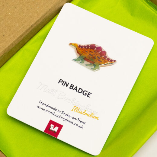 Matt Buckingham stegosaurus pin badge