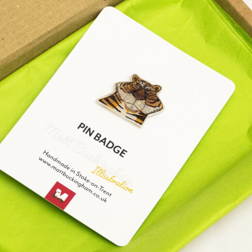 Tiger pin badge illustrated by Matt Buckingham